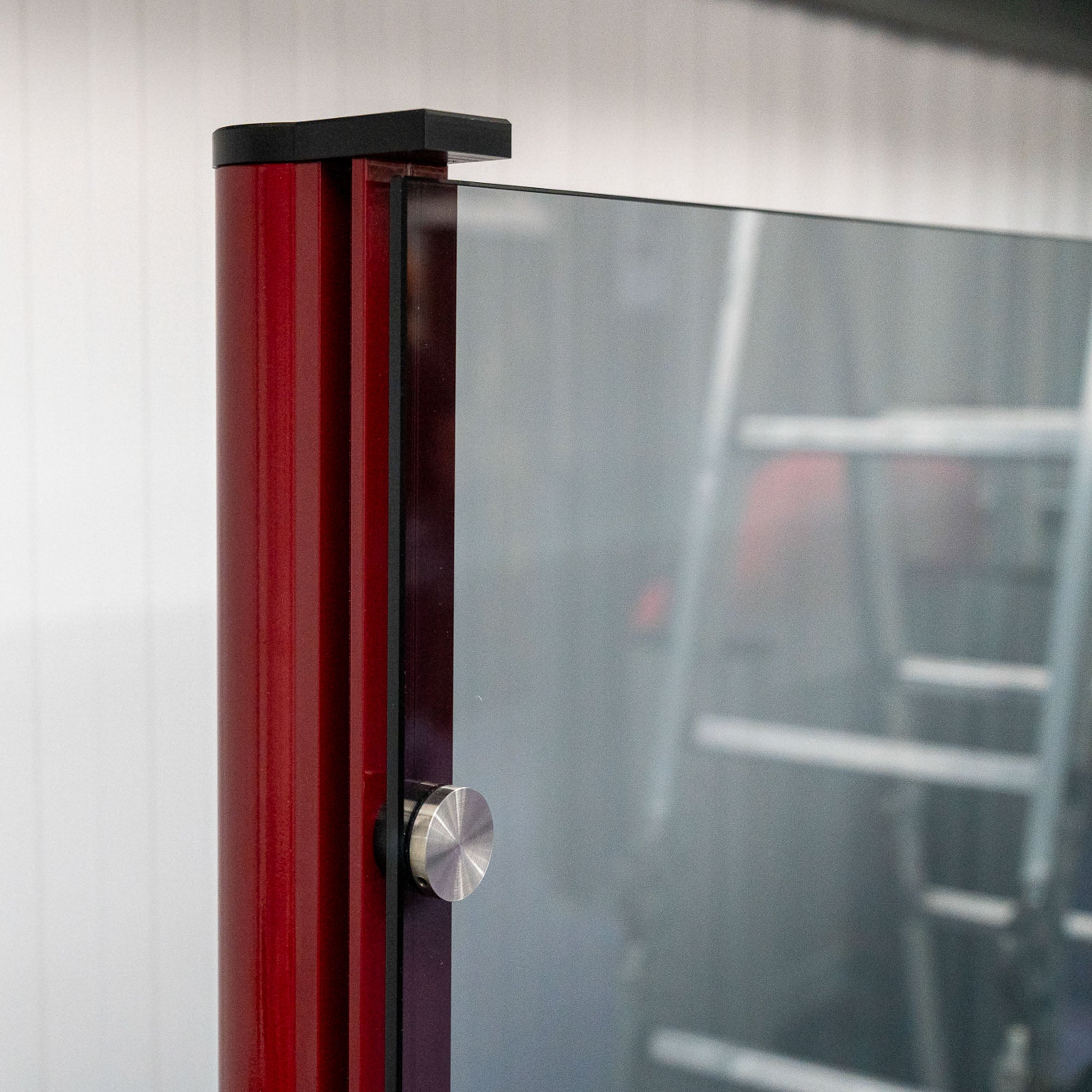 custom red coloured aluminium post for a glass screen 