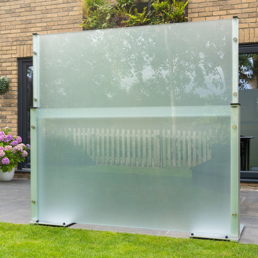 Frosted privacy glass panel extended to 6ft standing on a patio